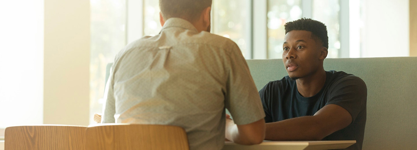 A client and agent discussing life insurance options.